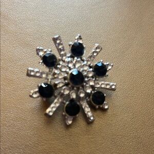 Stunning Black and Silver Starburst Brooch